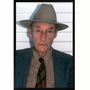 A color photo Bill Burroughs in full gangster mode. 