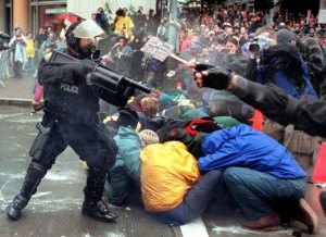 Photo of police threatening protestors in Seattle, 1999.