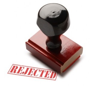An image of a rubber stamp that prints "rejected"